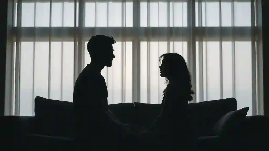 “Couple sitting apart in emotional tension symbolizing the power struggle stage.”