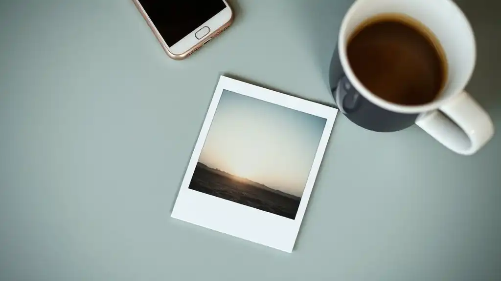Phone placed face down beside a journal representing emotional strength through silence.